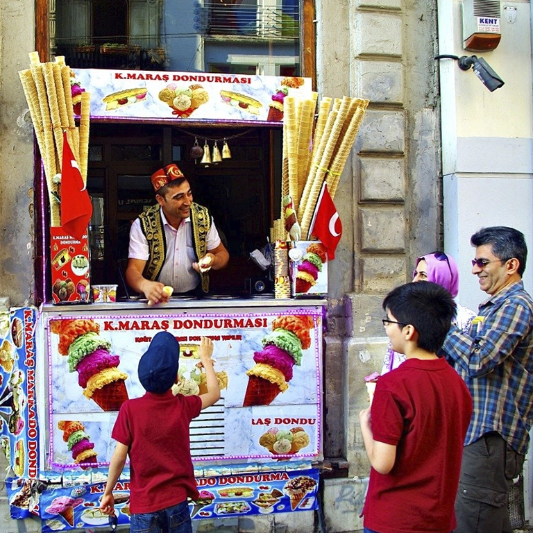 How does Marash's ice cream shop attract customers